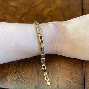 14k gold bracelet with gems amethyst garnet, citrine, topaz. 7 inches in length!